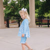 little girl wearing blue blossoms UPF 50+ top and shorts