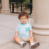 baby boy wearing green strip UPF tee and adventure short in khaki